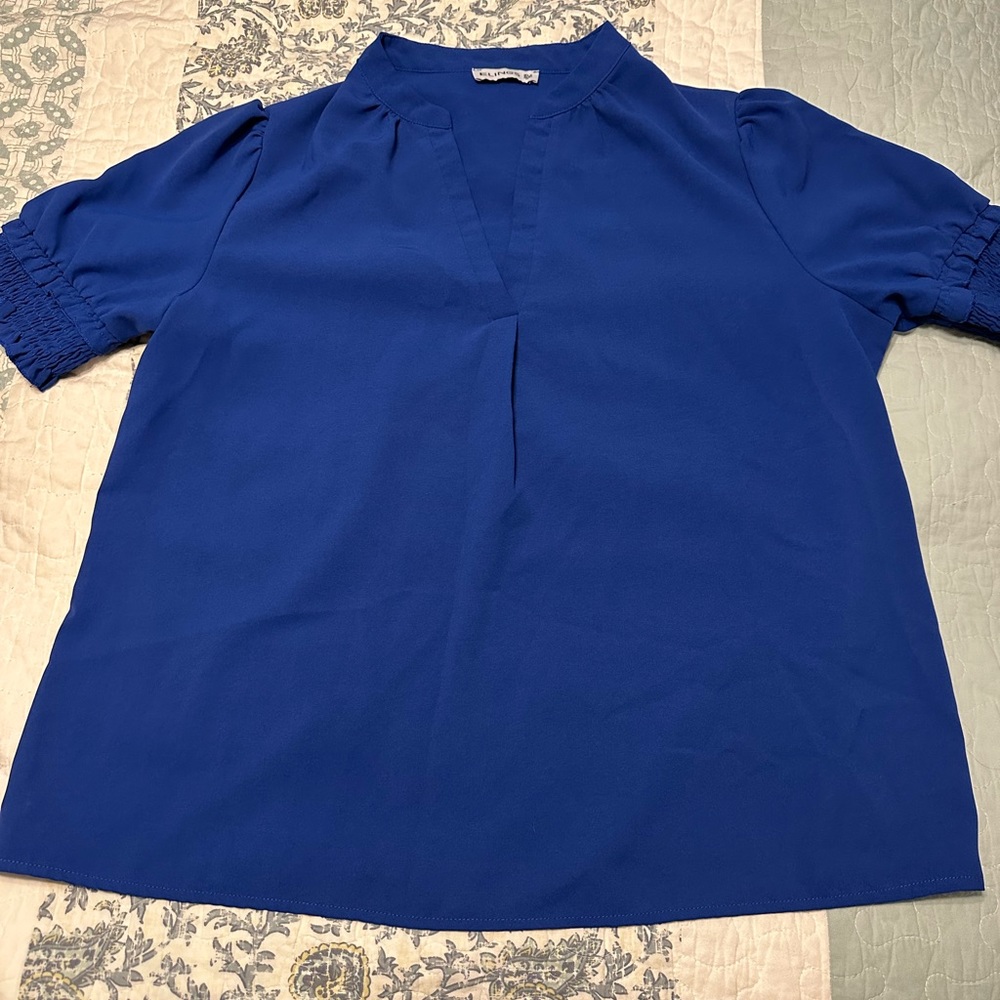 V-neck royal blue blouse with ruffle sleeves